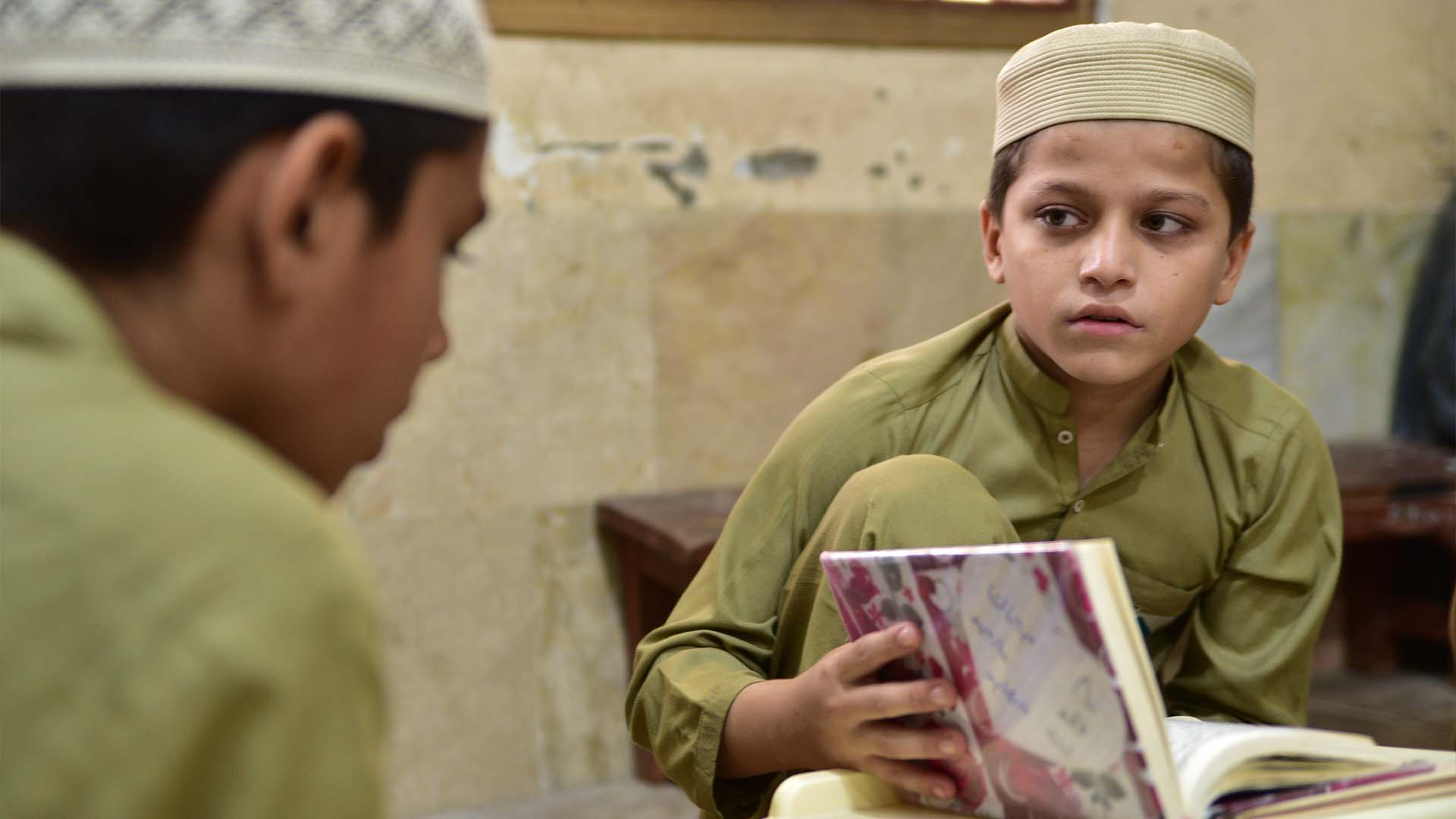 Students memorizing Quran in Binoria Madrasa