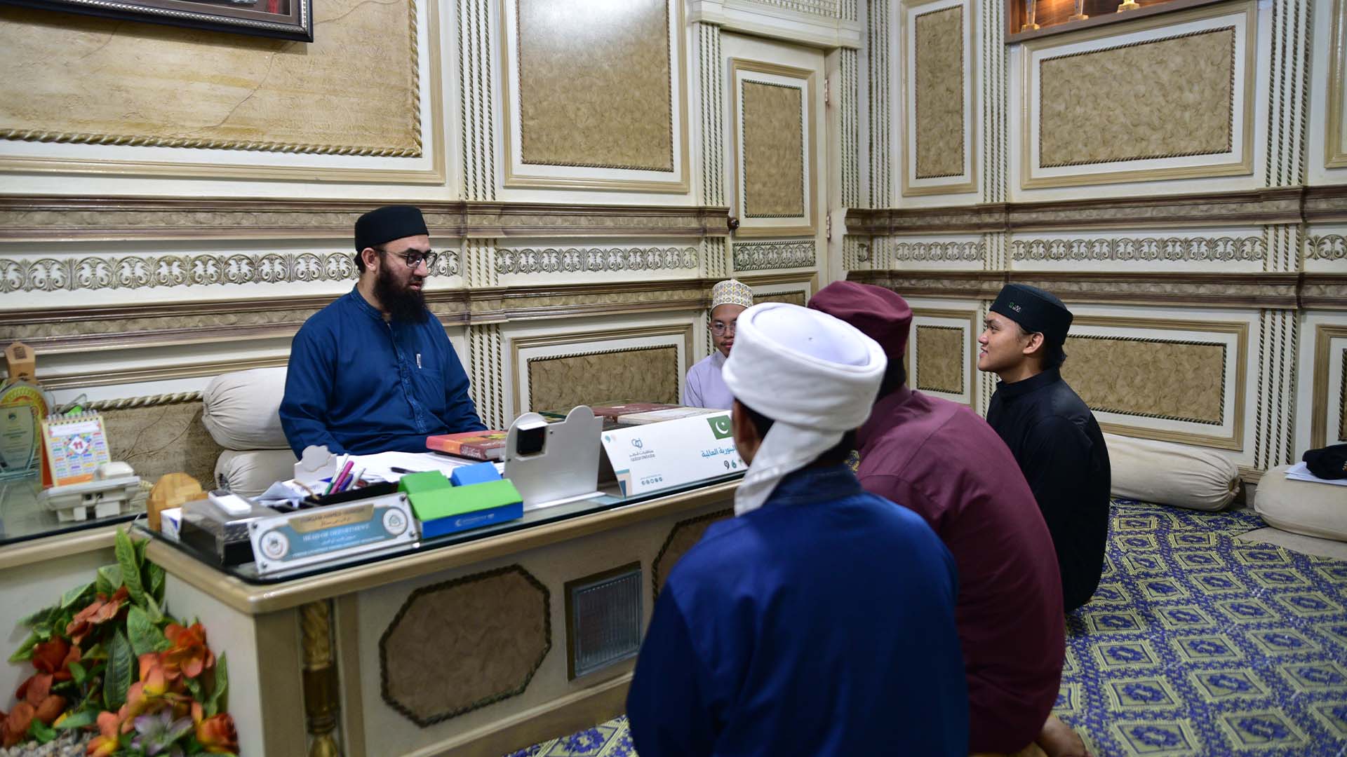 Nazim discussing with students