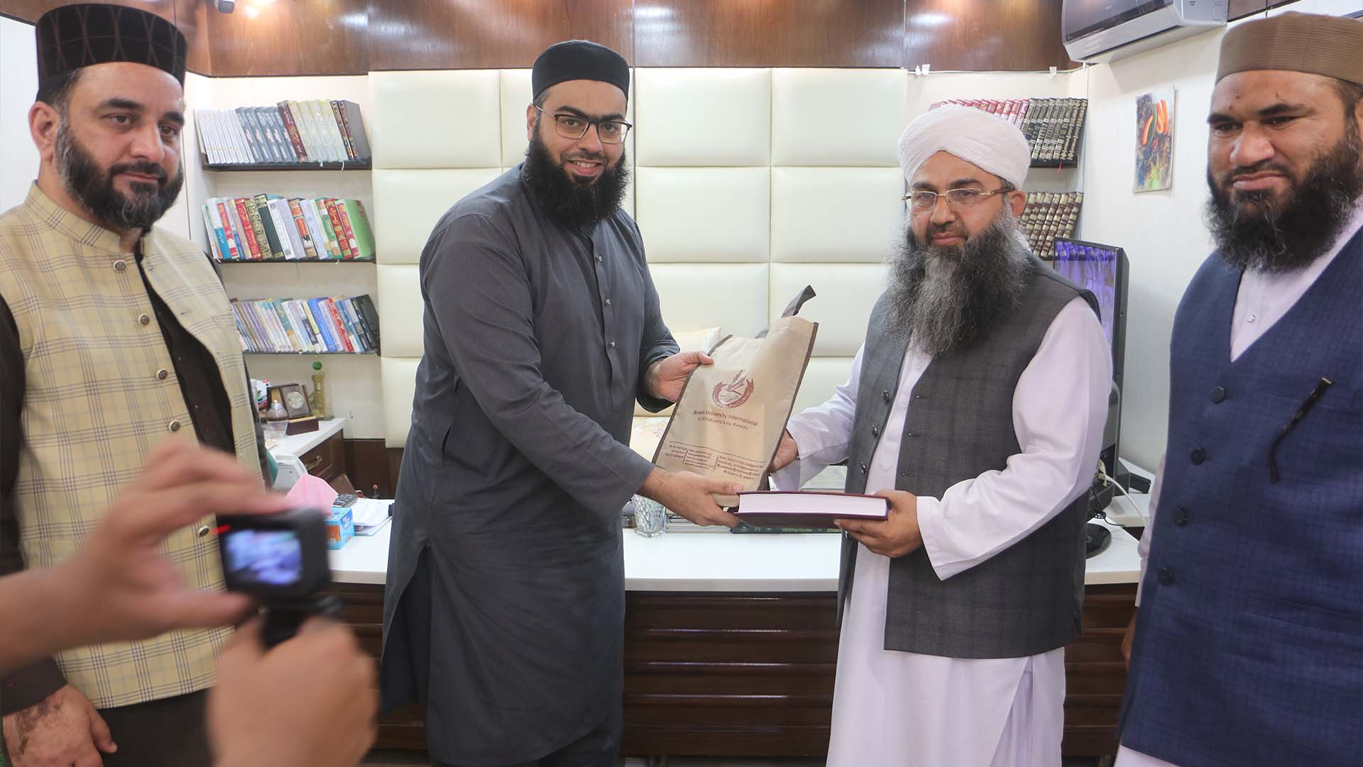 Noman Naeem Giving Honorary Award to Guest in Binoria